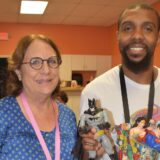 Janet and Michael with Marvel characters and tote