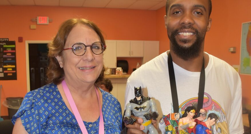 Janet and Michael with Marvel characters and tote