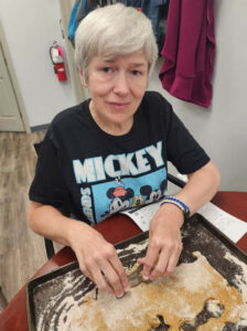 woman cutting out dog biscuits