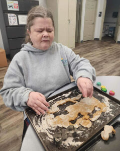 woman making dog biscuits